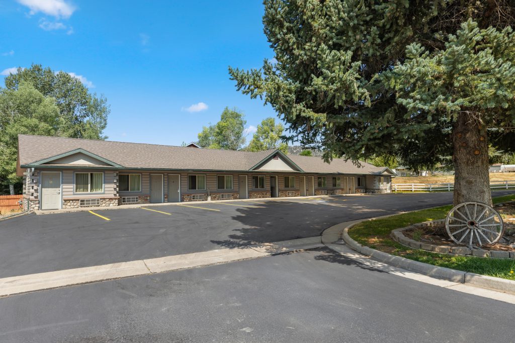 Guest room building and parking at the White River Inn in Meeker, Colorado